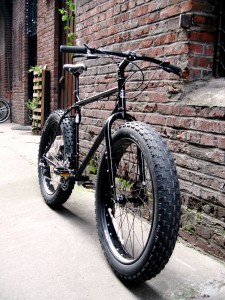 The Necro features the "extra" clearance fork from the Moonlander. Translated: You can fit a 4.8" tire upfront. 